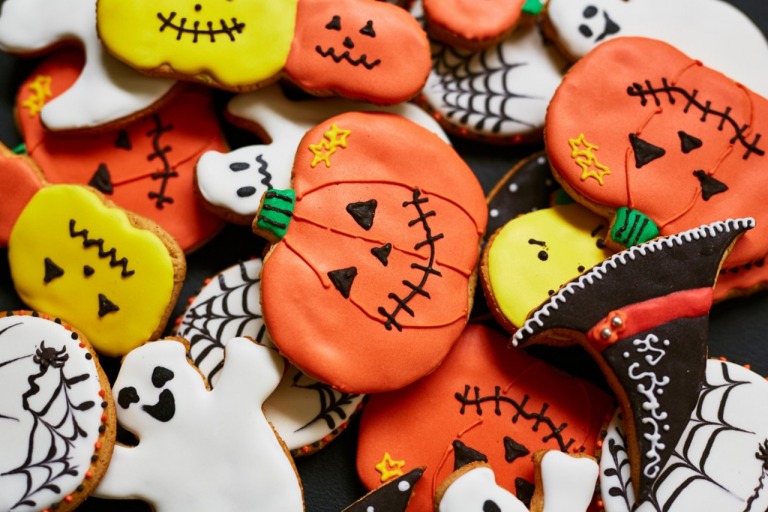 Trick-or-treat cookies in form of pumpkin, ghost and hat